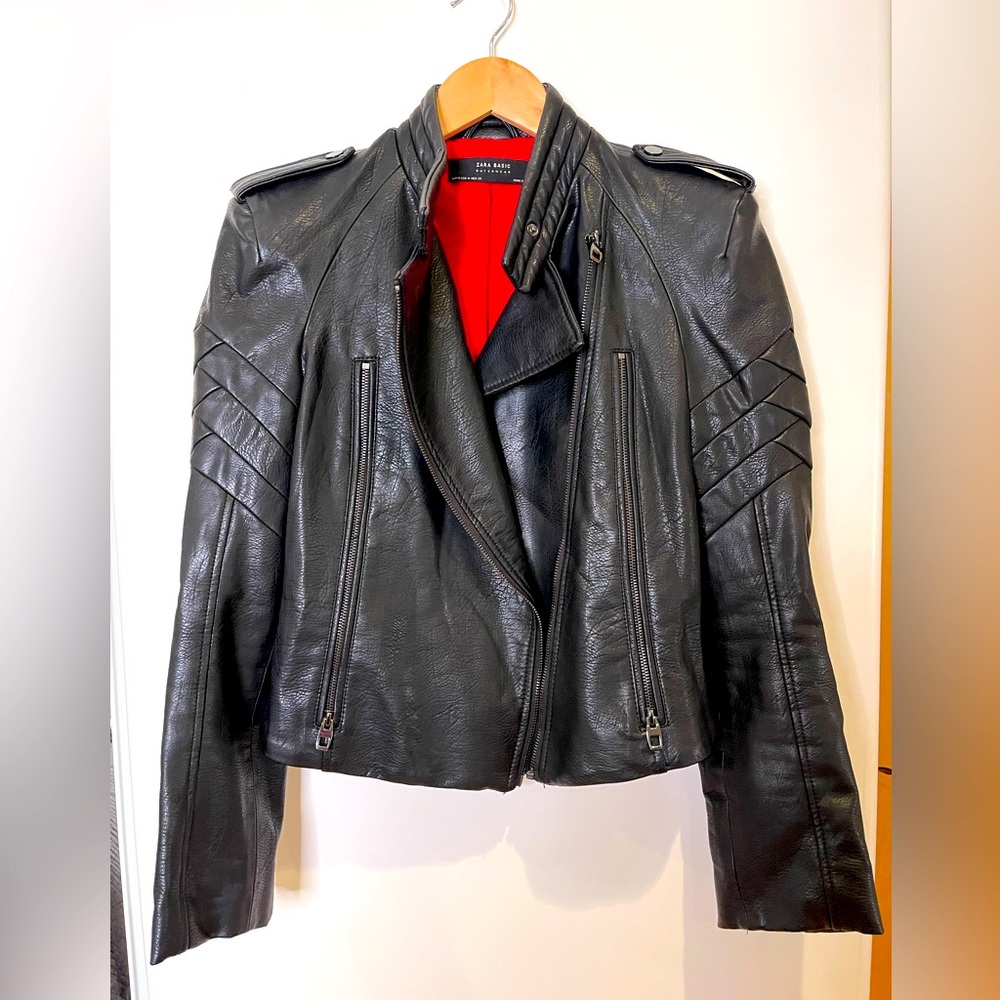 Black, structured, vegan leather moto jacket with red lining; size M
